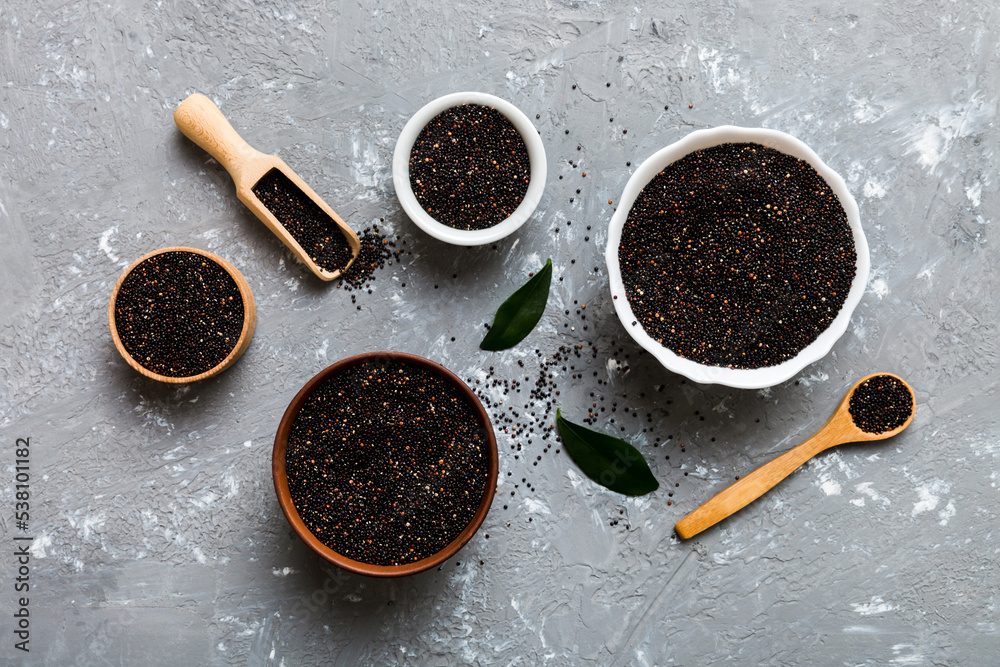 quinoa seeds in bowl and spoon on colored background. Healthy kinwa in small bowl. Healthy superfood quinoa seeds in bowl and spoon on colored background. Healthy kinwa in small bowl. Healthy superfood