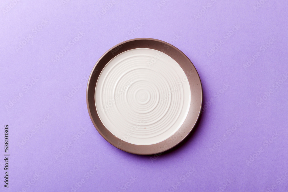 Top view of isolated of colored background empty round white plate for food. Empty dish with space for your design