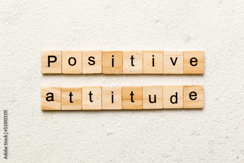 Positive Attitude word written on wood block. Positive Attitude text on cement table for your desing, concept