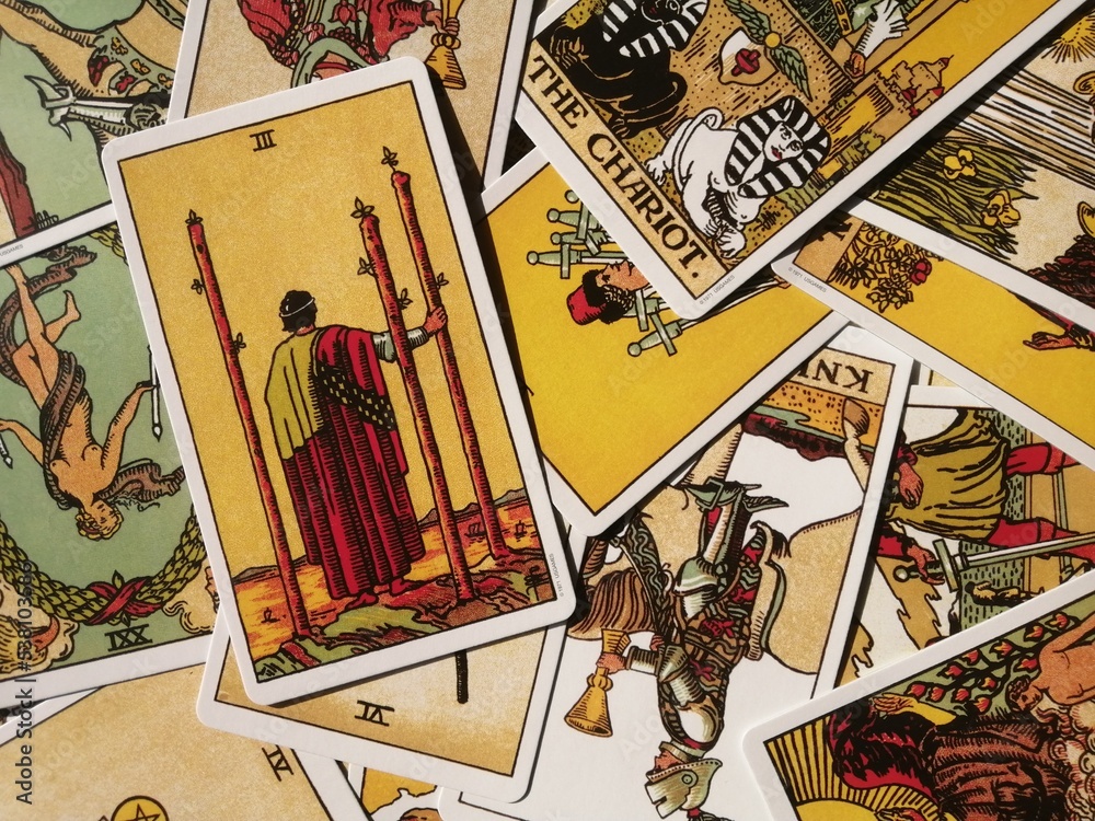 Picture the Three of Wands tarot from the original Rider tarot deck with mixed tarot cards in the background Stock-foto | Adobe Stock