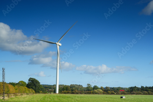 Image depicting motion of a horizontal axis wind turbine with slightly blurred blades in South Staffordshire in the UK photo