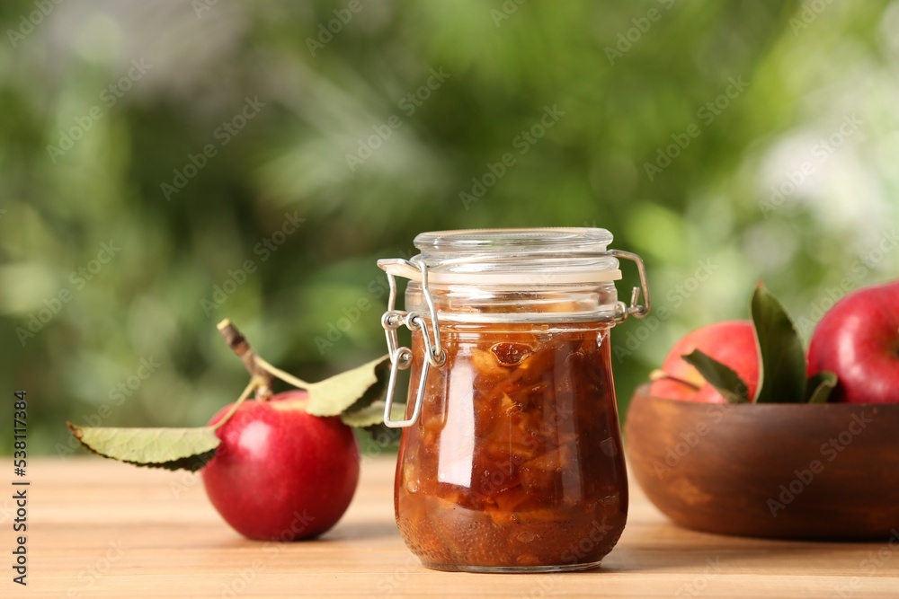 Delicious apple jam and fresh fruits on wooden table Delicious apple jam and fresh fruits on wooden table