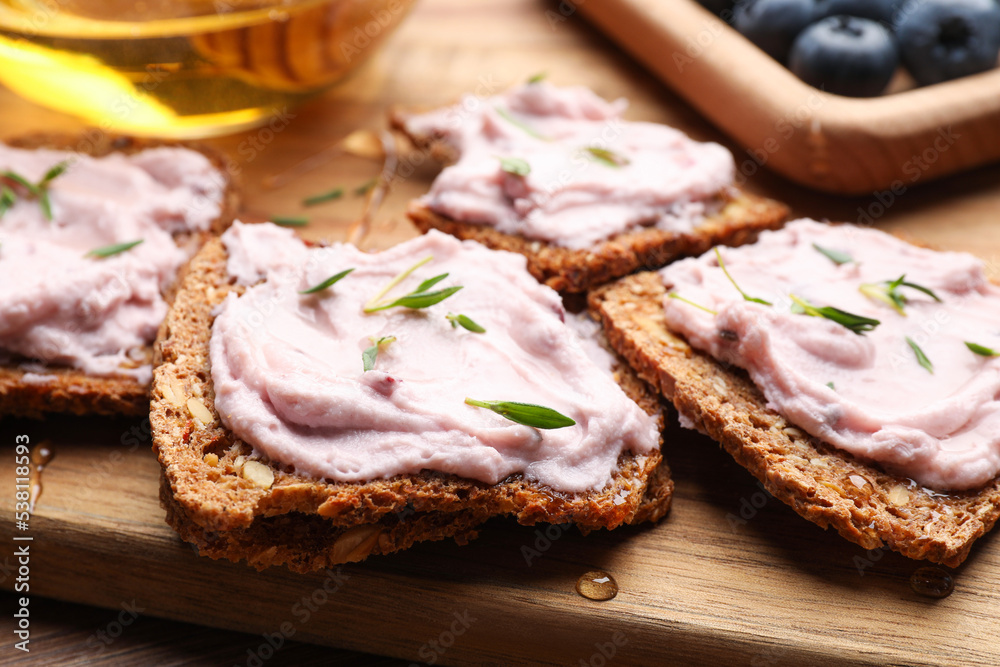 Tasty sandwiches with cream cheese and thyme, closeup