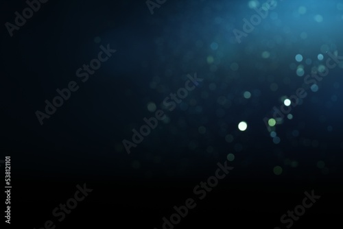 Blurred view of festive lights on blue background, space for text. Bokeh effect