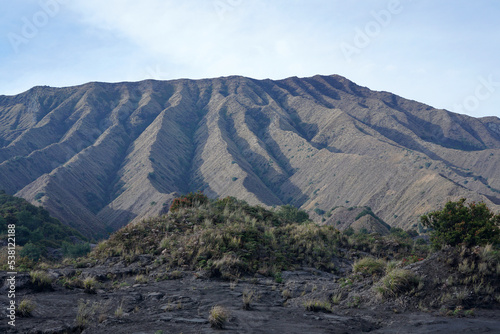 Mount Widodaren is located close to Mount Bromo and Mount Batok. Unique textured mountain surrounded by a sea of sand. 