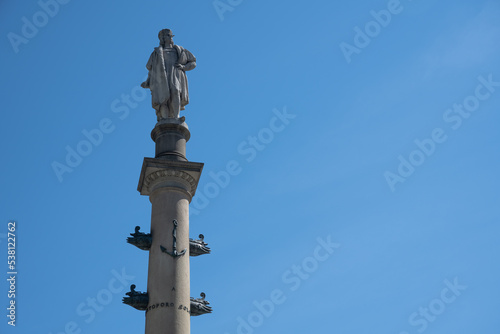 The Columbus Monument by Italian sculptor Gaetano Russo (1892) in Columbus Circle in New York City, seen against a blue sky
