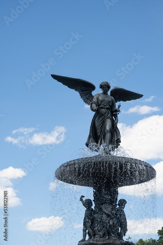 Bethesda Fountain (Angel of the Waters) in Central Park, designed by Emma Stebbins (1868), on a sunny summer day photo