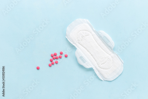 Menstrual cycle and protection concept with white pad, top view