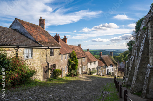 A view of the picturesque Gold Hill in the town of Shaftesbury in Dorset, UK. The hill was made famous by being in the iconic Hovis advert. photo