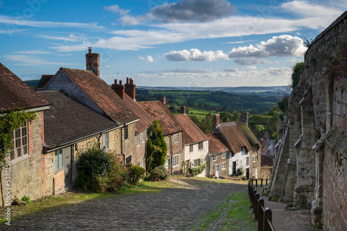 A view of the picturesque Gold Hill in the town of Shaftesbury in Dorset, UK. The hill was made famous by being in the iconic Hovis advert. photo