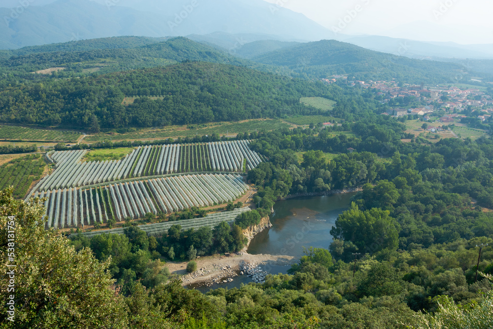View of a beautiful mountain landscape, fields and a river in the Pyrenees