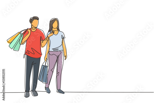 One single line drawing young happy romantic couple walking and shopping together while holding paper bags at mall. Commercial retail shopping concept. Continuous line draw design illustration