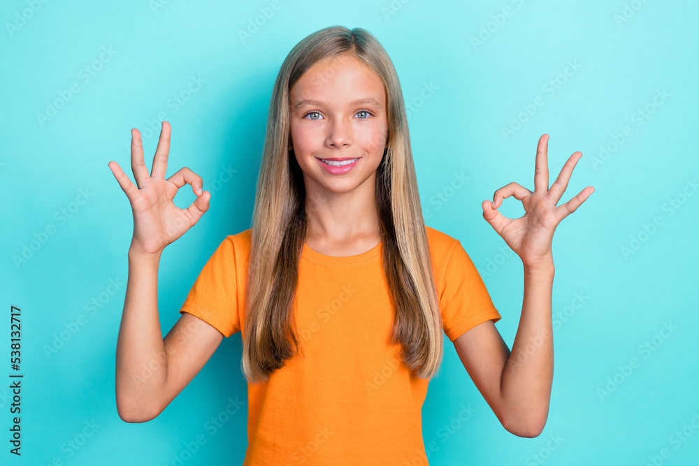 Fototapeta premium Photo of positve lady wear trendy outfit arm demonstrate okey symbol nice job give feedback empty space isolated on cyan color background