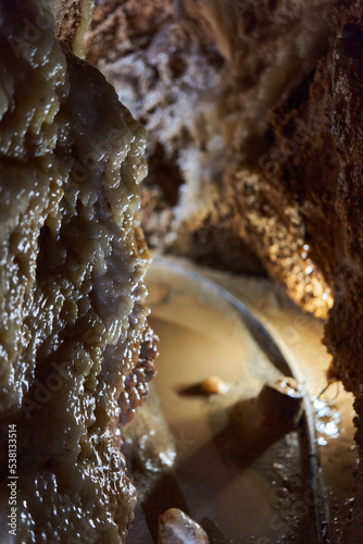 Crystals on speleothemes in a cave photo