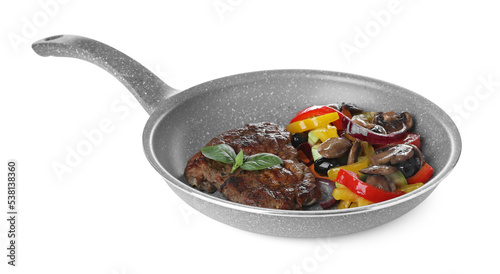 Tasty fried steak with vegetables in pan isolated on white