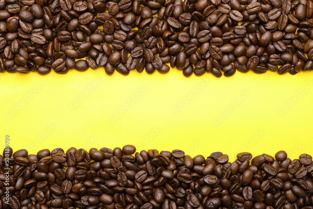 Coffee beans on yellow background, flat lay and space for text. Decaffeinated drink Coffee beans on yellow background, flat lay and space for text. Decaffeinated drink