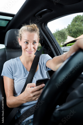 woman texting while driving a car