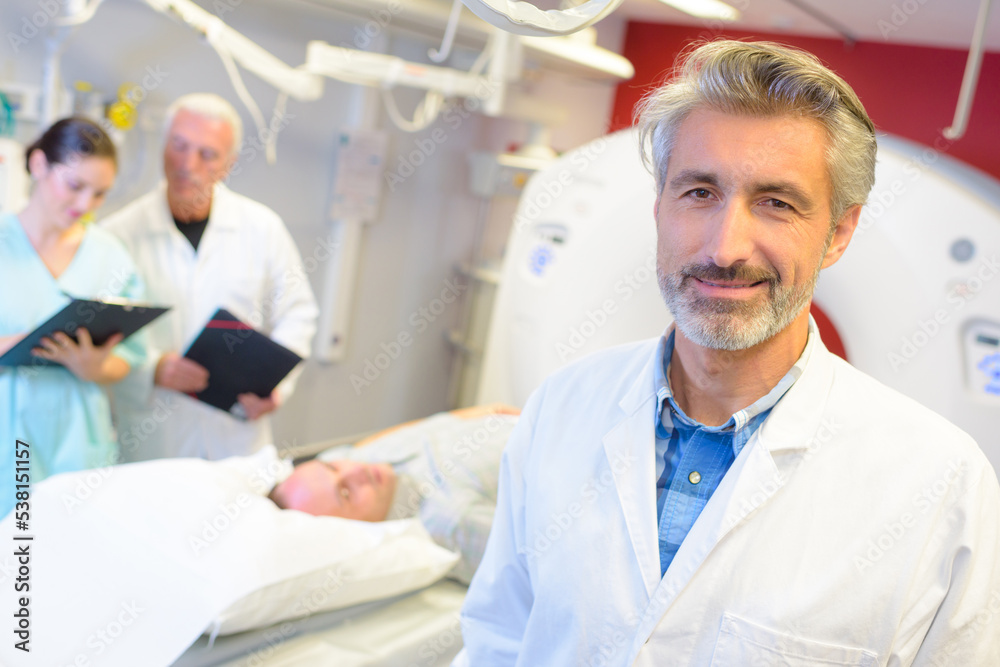 mri machine and screens with doctor and nurse mri machine and screens with doctor and nurse