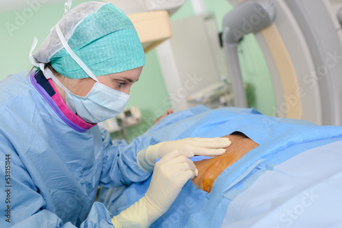 female surgeon in operating room photo