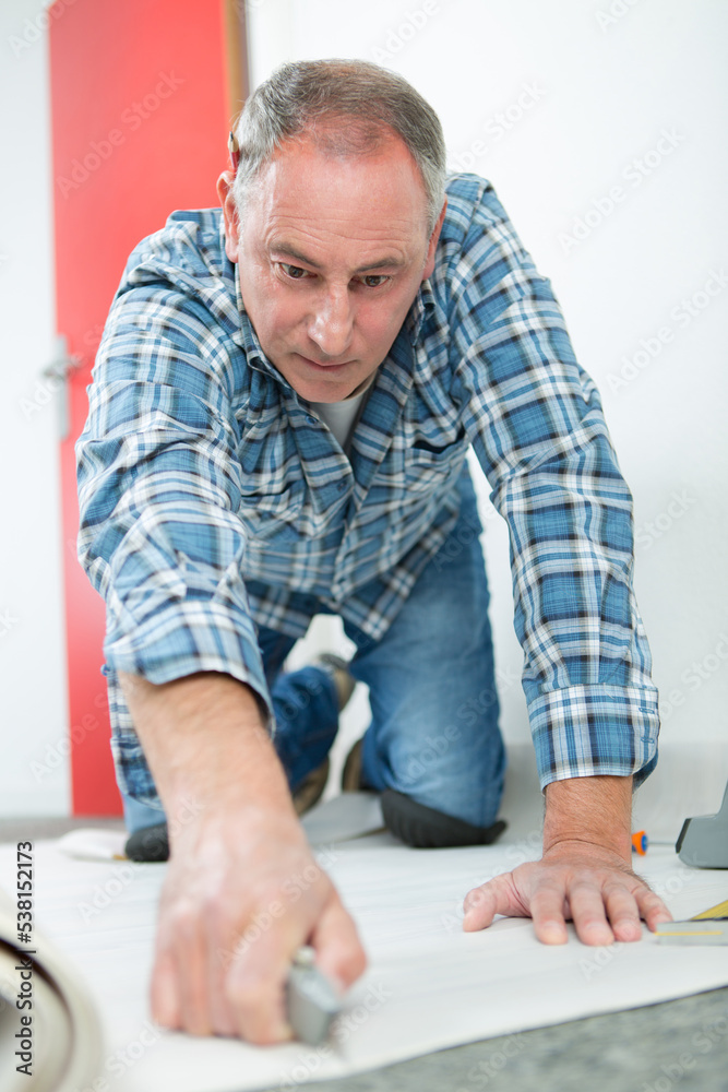 carpenter joiner worker preparing door frame for indoor installation carpenter joiner worker preparing door frame for indoor installation