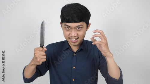 Psychosis man holding knief gesture to attack you,Mad man screaming to kill you halloween concept