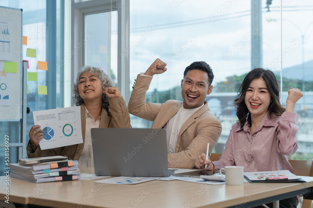 Team of successful business financial is celebrating the receiving of positive answer from the investors Team of successful business financial is celebrating the receiving of positive answer from the investors