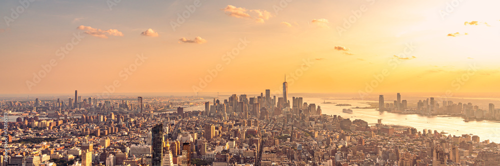 Golden sunset panorama aerial view of New York skyscrapers on Manhattan island