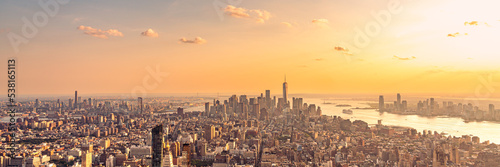 Golden sunset panorama aerial view of New York skyscrapers on Manhattan island