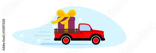 A pickup truck delivers a large holiday gift.