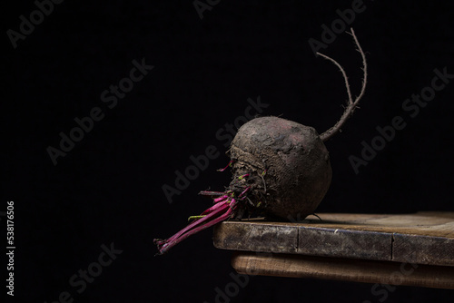 Beets on a black background. Delicious and healthy vegetable. Vegetarian food