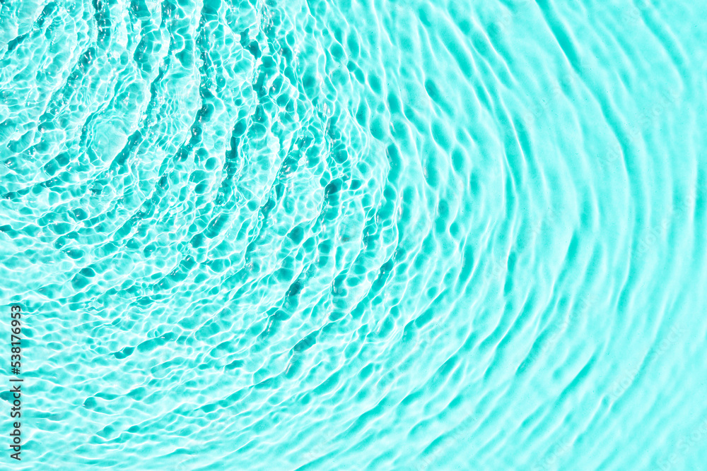 Turquoise water texture background, water surface with sun rays reflection, high resolution. Turquoise water texture background, water surface with sun rays reflection, high resolution.