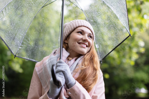 Konstfotografi portrait of woman holding transparent umbrella