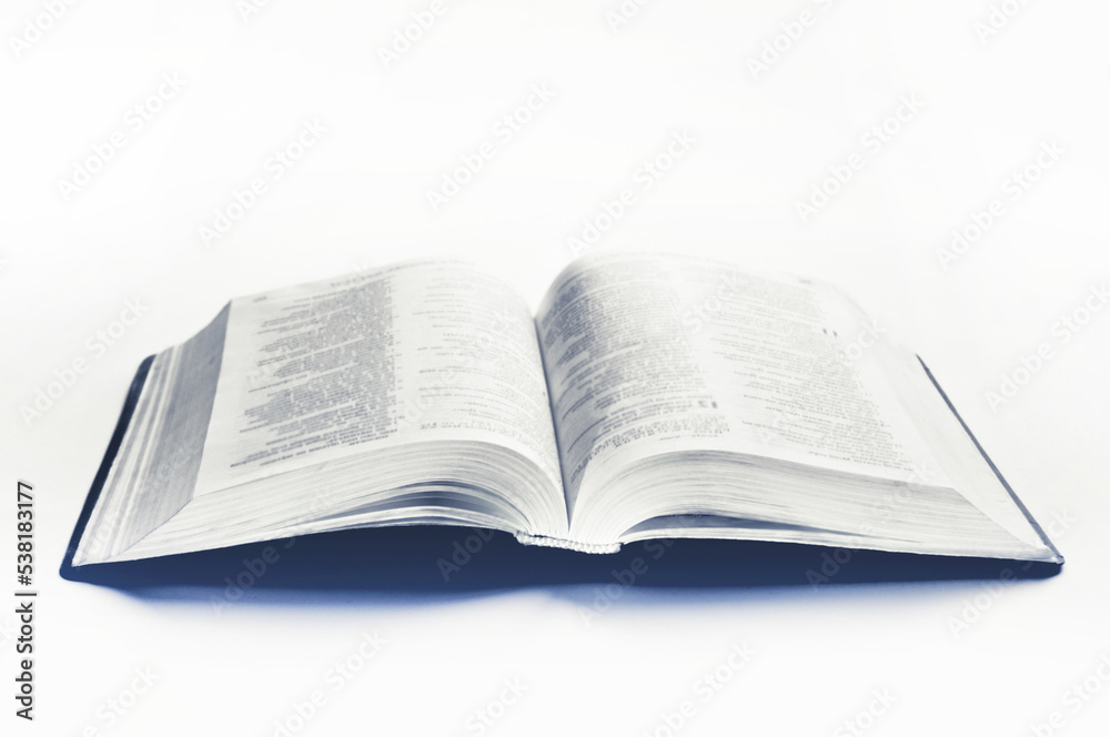 An open Bible on a white background. Scripture An open Bible on a white background. Scripture
