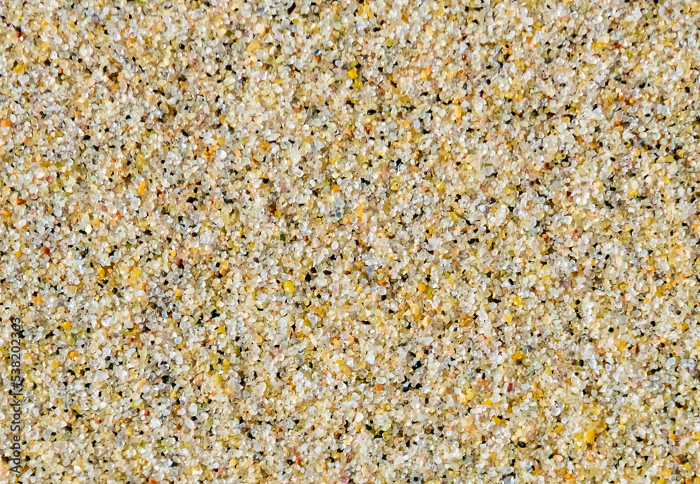 Beach grains sand surface texture. Background. Top view close-up. Beach grains sand surface texture. Background. Top view close-up.