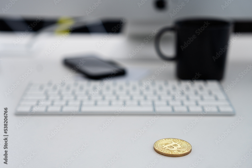 cryptocurrency lying on the desk - sales tax