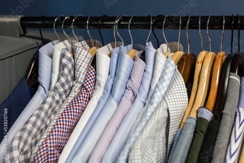 Mens shirts on a clothes hanger with a gaussian blurred background. business clothes