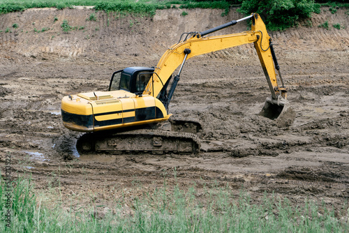 Construction crawler excavator working on construction site.