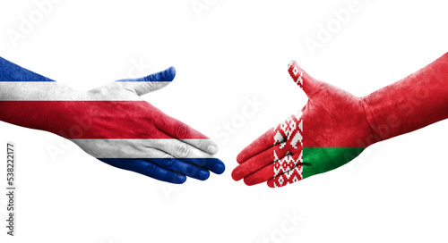 Handshake between Belarus and Costa Rica flags painted on hands, isolated transparent image.