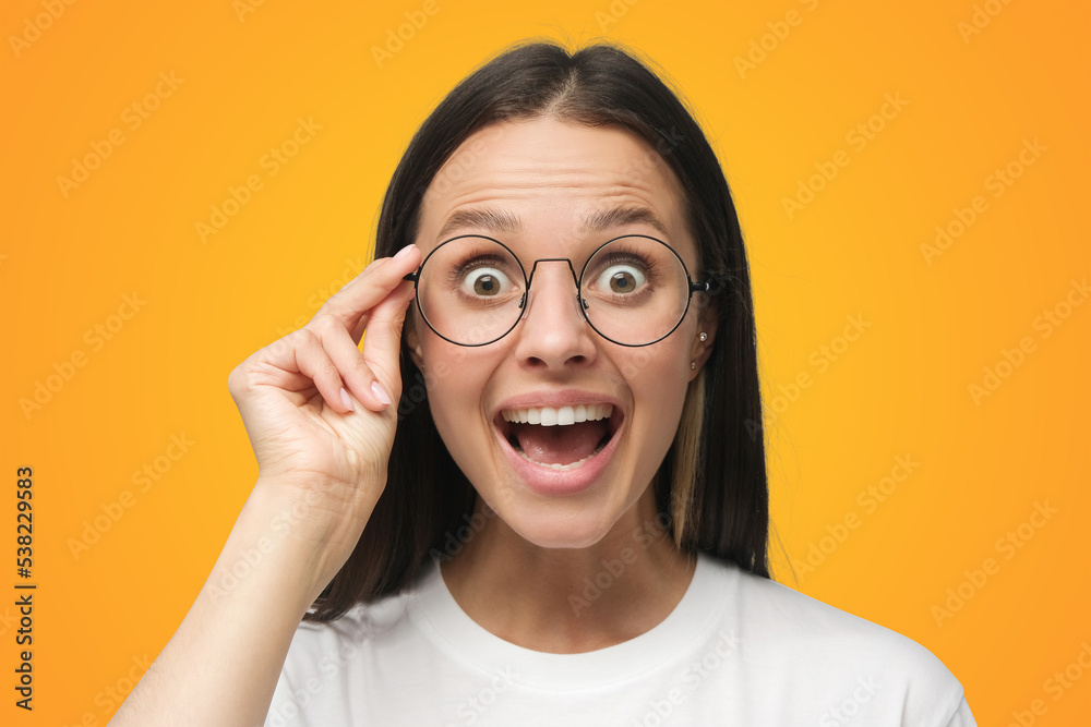 Woman in white t-shirt shouting oh my god with open mouth, surprised by low price and sales Woman in white t-shirt shouting oh my god with open mouth, surprised by low price and sales