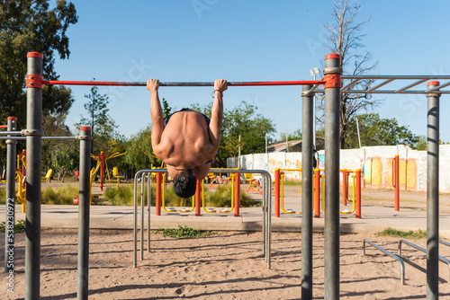 sportsman doing outdoor gymnastics, athlete, calisthenics