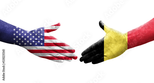 Handshake between Belgium and USA flags painted on hands, isolated transparent image.