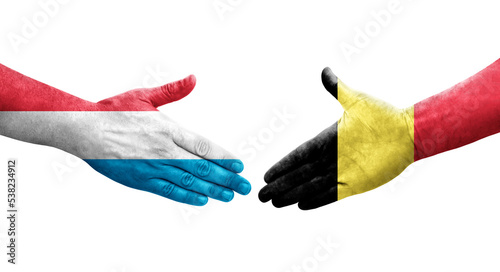 Картината върху платно Handshake between Belgium and Luxembourg flags painted on hands, isolated transparent image