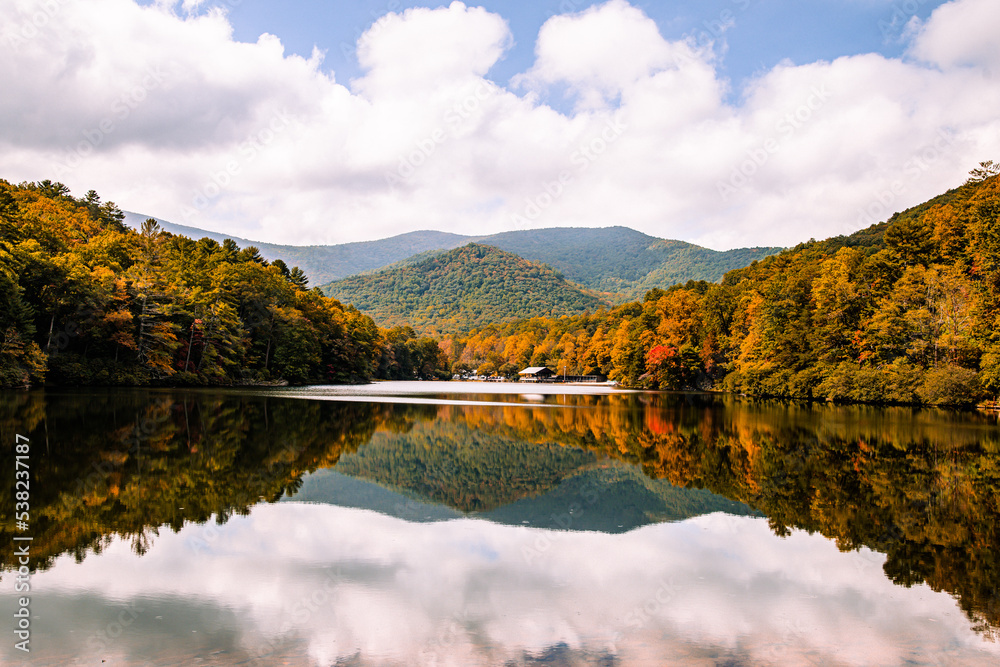 autumn in the mountains with reflections in lake water at Vogel state park, Georgia