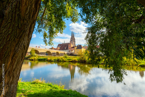 The picturesque skyline including the stone bridge over the Danube River, Saint Peter's Church and Regensburg Town Hall in the Bavarian city of Regensburg, Germany. 