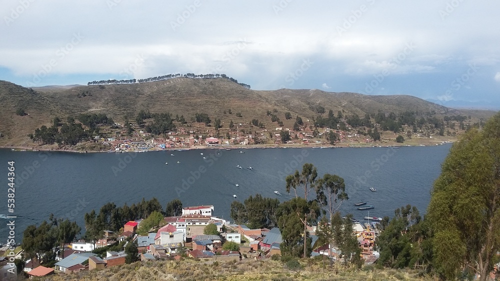 Lake Titicaca located on the border of Boliva and Peru, and small villages around the lake