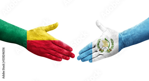 Handshake between Benin and Guatemala flags painted on hands, isolated transparent image.