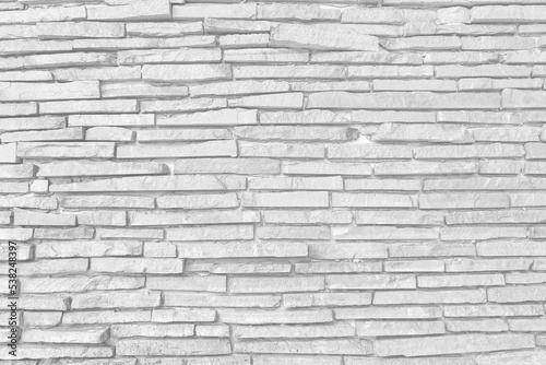 pattern of decorative white slate stone wall surface. Surface white wall of stone wall gray tones for use as background.