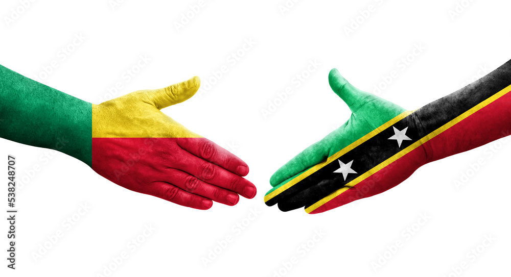 Handshake between Benin and Saint Kitts and Nevis flags painted on hands, isolated transparent image. Handshake between Benin and Saint Kitts and Nevis flags painted on hands, isolated transparent image.