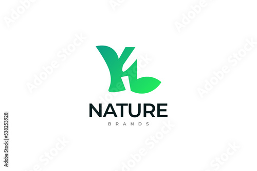 Initial Letter Y and L Logo with Green Leaf Shape
