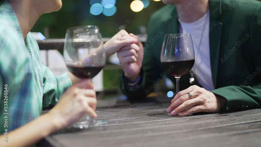 4K Happy Asian couple celebrating holiday event at luxury restaurant in the city at night. Man and woman enjoy city lifestyle having dinner and drinking wine together at bar terrace on travel vacation 4K Happy Asian couple celebrating holiday event at luxury restaurant in the city at night. Man and woman enjoy city lifestyle having dinner and drinking wine together at bar terrace on travel vacation